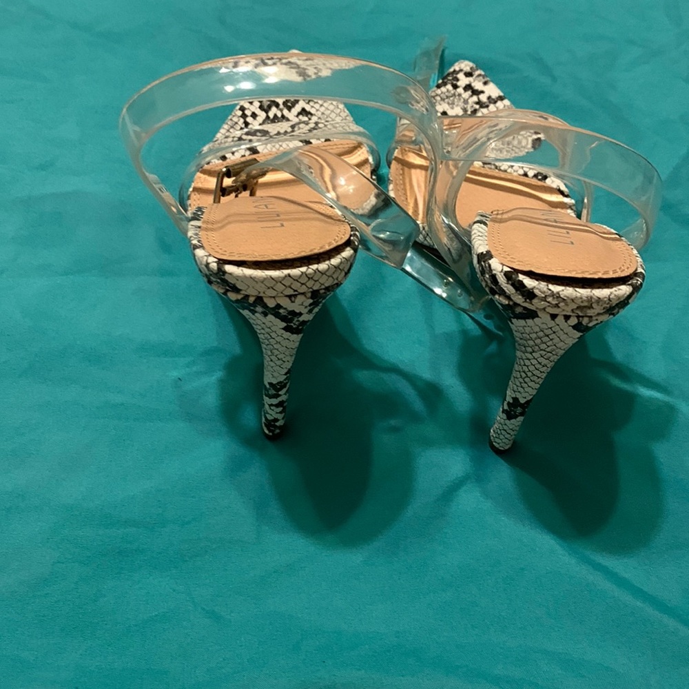 These Liliana rattlesnake pattern clear ankle strap heals size 7 are very nice.